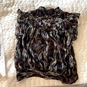 Multi color, smocked,flutter sleeve top tie at bottom can be worn front or back